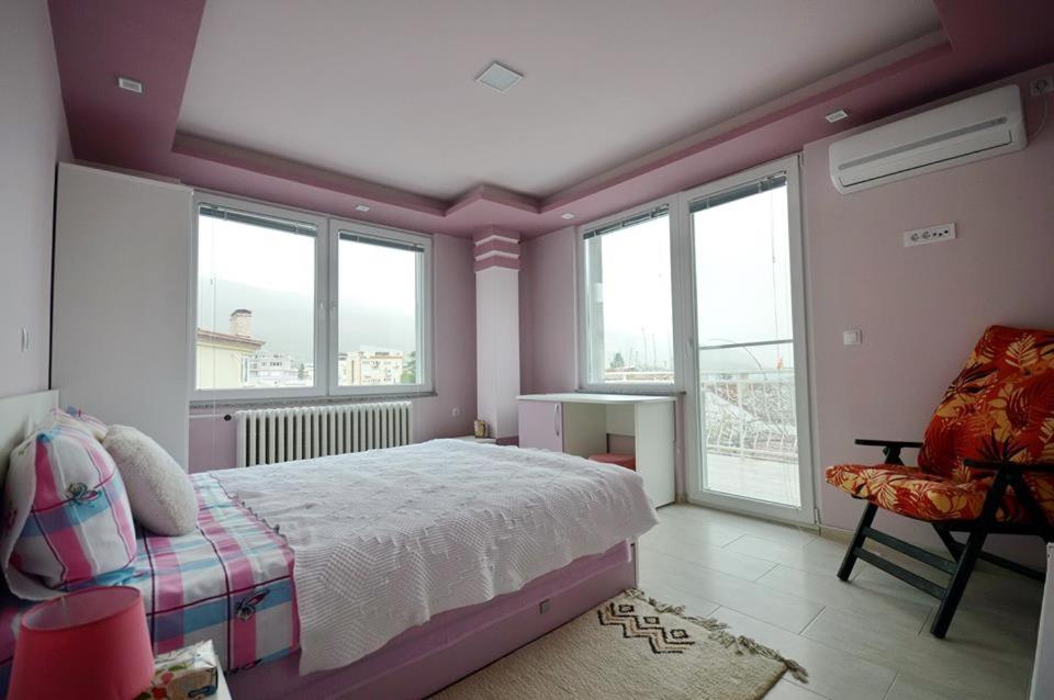 Villa Metulevi cozy bedroom with warm orange tones